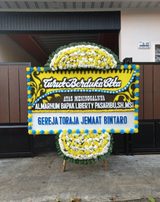 Papan Bunga Duka di Madidir